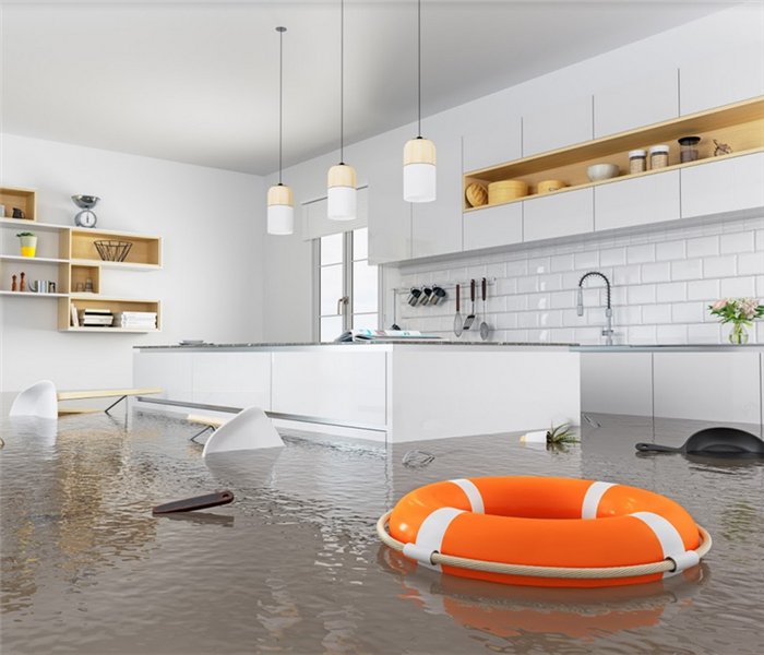 flooded kitchen with items floating on the surface